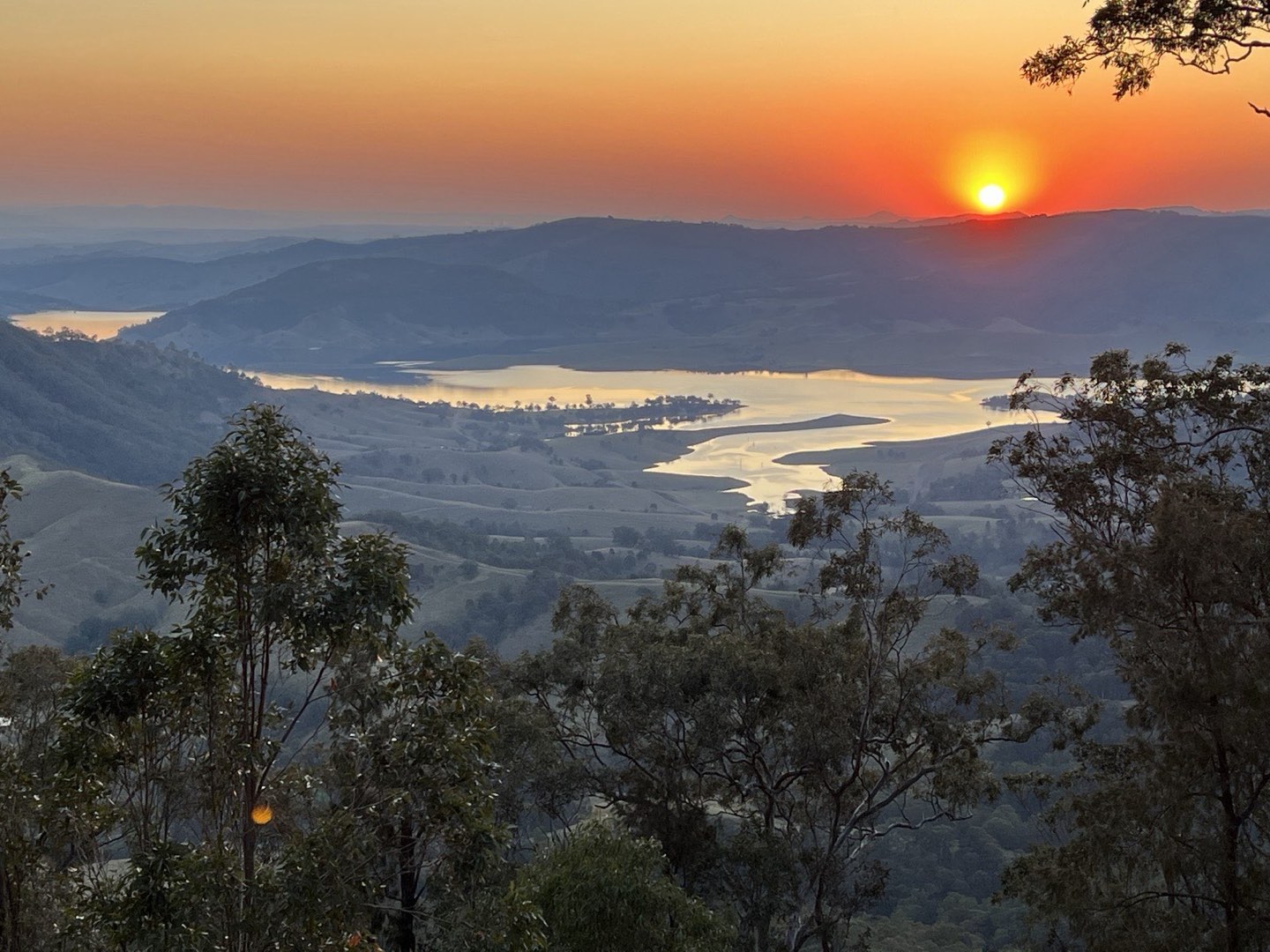 Sunset over the lake and surrounding hills